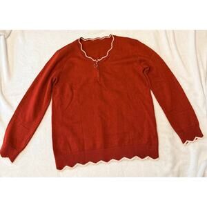 burnt orange quarter-zip pullover sweater with white-trimmed scalloped neckline